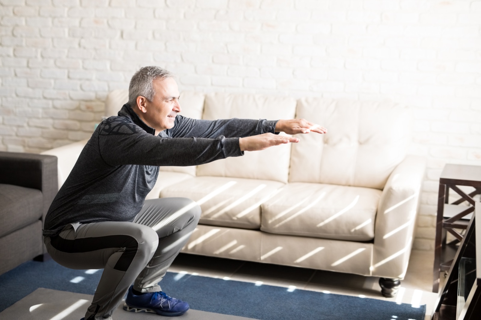 Woman doing a squat exercise for better blood sugar control