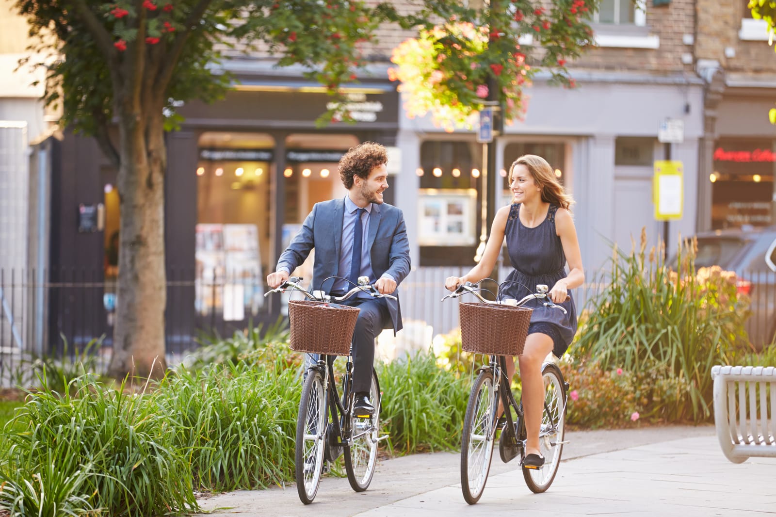 Couple Cycling City Street