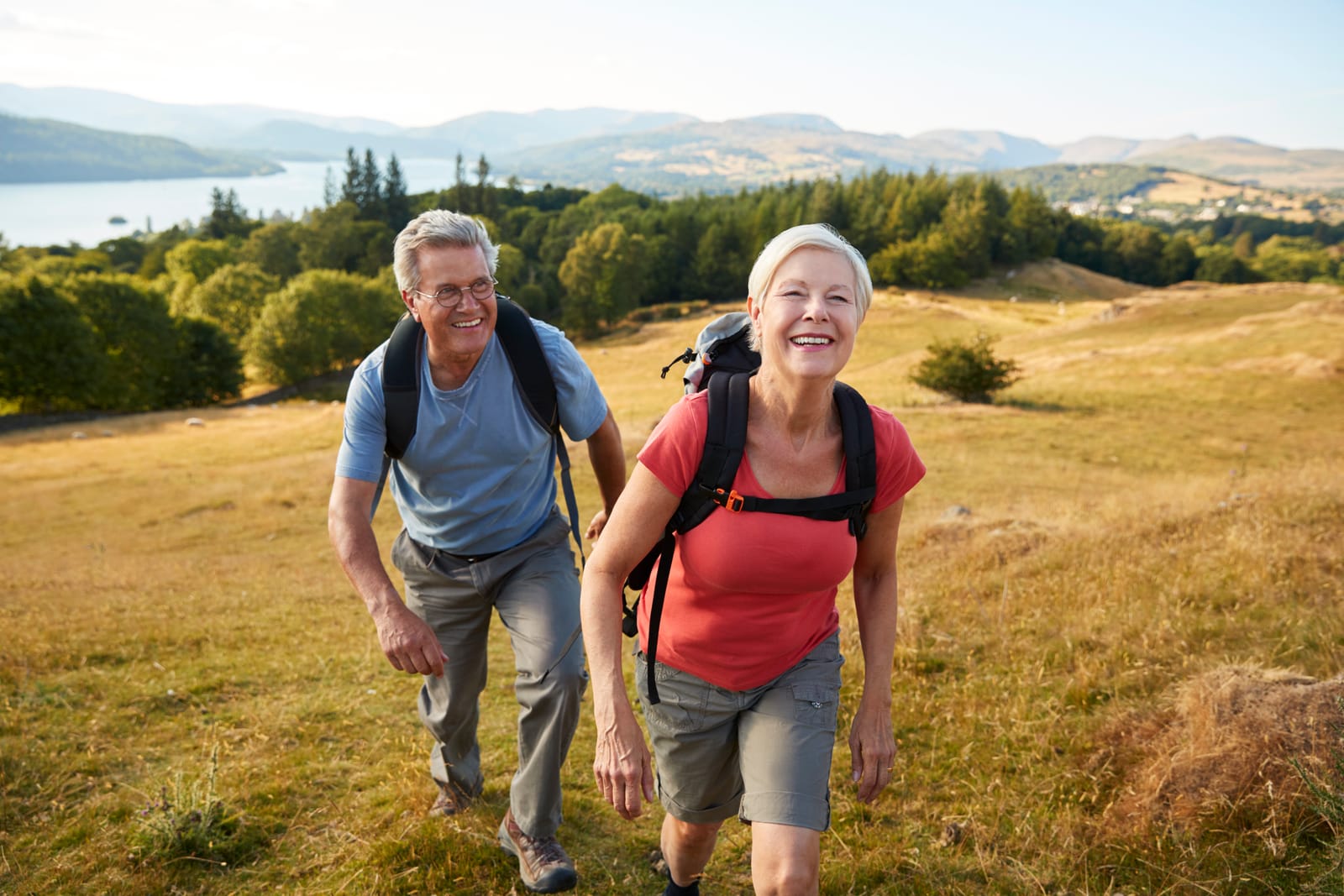 Senior Couple Hiking Hillside