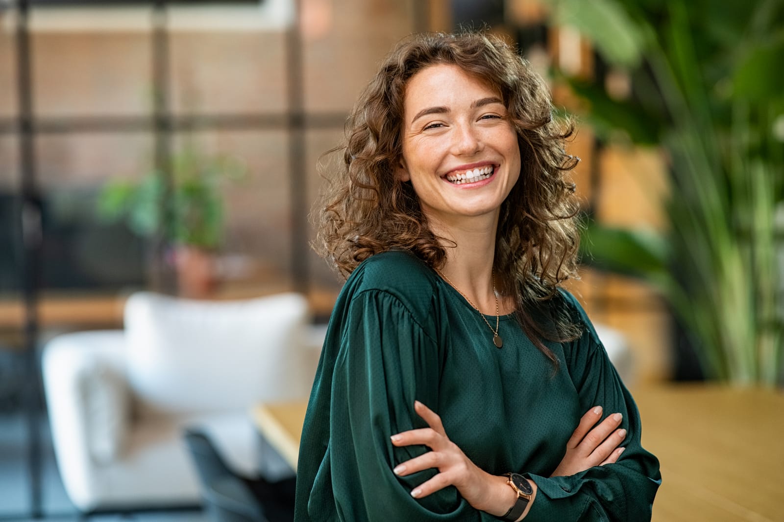 Woman Green Blouse Arms Crossed Office