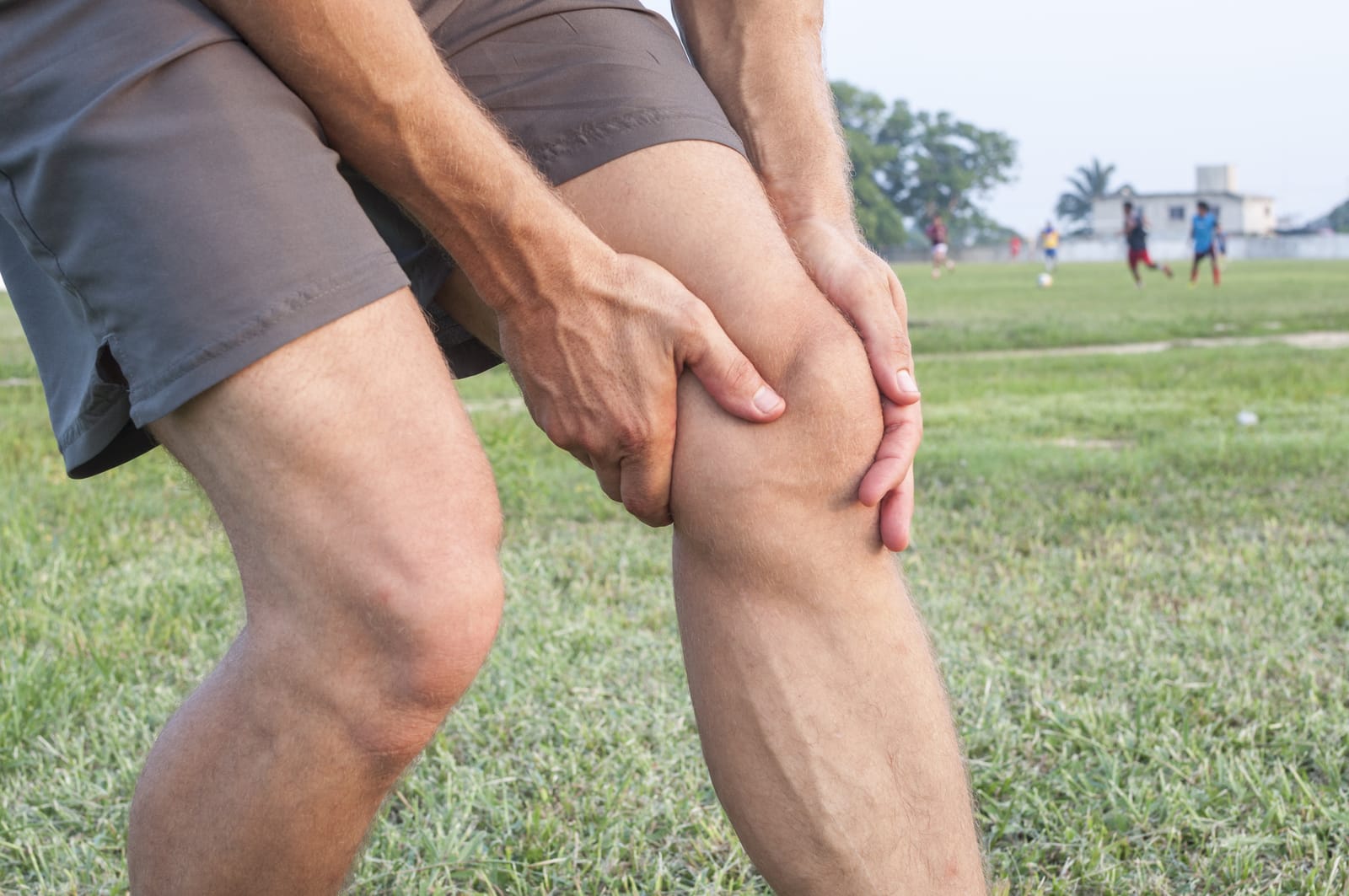 Man Holding Sore Knee
